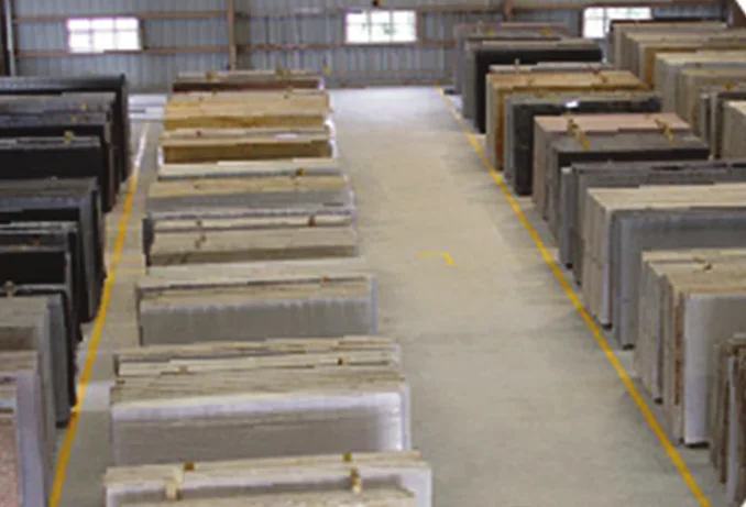 Stone slabs arranged in a supplier warehouse